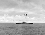 SBD Dauntless scout bomber in the landing pattern preparing to come aboard USS Essex following the raid on Marcus Island, Pacific Ocean, 31 Aug 1943.