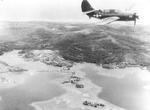 SB2C Helldiver from USS Essex flying over Yap, Caroline Islands, after the Japanese surrender, 28 Aug 1945