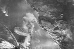 Carrier aircraft of US 3rd Fleet planes attacking cruiser Oyodo, Etajima, Japan 28 Jul 1945; photo taken by aircraft from USS Wasp (Essex-class)