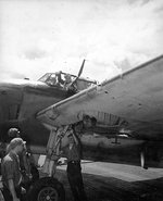 TBM Avenger of Torpedo Squadron VT-10 aboard USS Enterprise with machine gun holes in the wing following air-to-air combat with a Japanese Kawasaki Ki-61 “Tony” fighter off Truk, Caroline Islands, 16 Feb 1944.