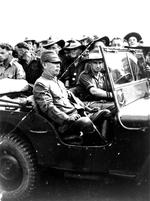 Australian soldier Frederick Bishop driving Japanese Lieutenant General Hatazo Adachi to the Wom Airstrip, New Guinea for the formal New Guinea surrender ceremony, 13 Sep 1945