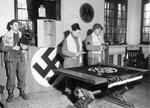 Jewish chaplain (Rabbi) Captain Manuel Poliakoff of the US Army 29th Infantry Division (center) conducting a memorial service in Schloss Rheydt, the former home of Joseph Goebbels, 18 Mar 1945.