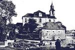 Lidice, Czechoslovakia in the 1930s. St. Martin’s church built in 1732 with one of the village’s barns in the foreground.