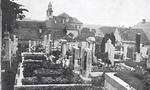 Lidice, Czechoslovakia in the 1930s. St. Martin’s church built in 1732 seen in the distance from the village cemetery.