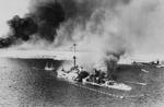 Italian cruiser San Giorgio after being scuttled in the harbor at Tobruk, Libya as Australian troops entered the city, 22 Jan 1941. Note torpedo nets. Photo 1 of 2.