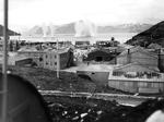 Japanese naval shells exploding in the harbor at Dutch Harbor, Aleutian Islands, Alaska as part of the Aleutian diversion for the Midway attack, 4 Jun 1942.