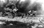 A smoke screen masks the advance of a Russian anti-tank gun crew in Russia, 23 July 1943. Note Degtyaryov PTRD-41 anti-tank rifle.