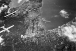 B-25 Mitchell bombers of the 13th Air Force over the Japanese forward base at Simpson Harbor, Rabaul, New Britain, 5 Mar 1944