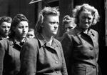 Female SS guards at Bergen-Belsen being put to work by the liberating British force, 17 Apr 1945.