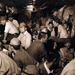 Demobilized Japanese soldiers and civilians aboard a train in Hiroshima, Japan, Sep 1945