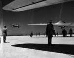 Aboard two Mitsubishi G4M ‘Betty’ bombers in surrender markings, a Japanese delegation stopped at Ie Jima, Ryukyu Islands en route Manila, Philippines for a surrender briefing, 19 Aug 1945. Photo 01 of 12.