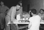 Lieutenant General Joseph Stilwell speaking to soldiers in the mess hall of 112th Station Hospital, Calcutta, India, 30 Jul 1944