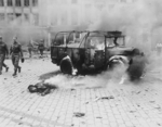 The smoldering remains of a V-2 rocket attack, Teniers Square, Antwerp, Belgium, 27 Nov 1944