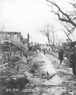 US Marines in a destroyed town on Guam, Jul-Aug 1944