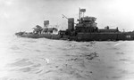 Minesweeper USS Tide with her back broken and sinking after triggering a magnetic mine off Utah Beach, Normandy, France, 7 Jun 1944.