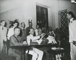 British Rear Admiral Cecil Harcourt receiving the sword of Japanese Army Major General Umekichi Okada during the Hong Kong surrender ceremony, Government House, Hong Kong, 16 Sep 1945.