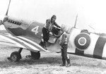 US Navy Lt Robert F Doyle shaking hands with his wingman, Ens John F Mudge, after their return from a gunfire-spotting and strafing mission over the Normandy beaches, Lee-on-Solent, Hampshire, England, UK, Jun 1944.