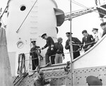 US Coast Guard Captain AC Richard disembarking USS Augusta during a tour of the beachhead by senior officers, 14 Jun 1944, off Omaha Beach, Normandy, France.