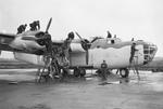 Staged photo of maintenance crews servicing a Liberator III of RAF No 224 Squadron at Beaulieu, Hampshire, United Kingdom, Dec 1942.