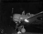 WAAF mechanics M. Agnew, M. H. Arnott, and C. W. Fraser inspecting a M.19 Master II aircraft at RAF Errol, Scotland, United Kingdom, 1940s