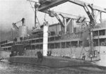 USS Proteus transferring a Polaris missile to USS Patrick Henry, Holy Loch, Scotland, United Kingdom, 1961, photo 2 of 2