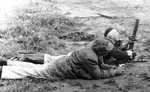 Manfred Barak and Avraham Kane of the Haganah firing a 2-inch mortar, Palestine, 1943