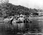 Torpedo damage to the stern of USS Portland as she was undergoing temporary repairs at Tulagi, Solomon Islands. The blast took off Portland’s two inboard propellers, jammed the rudder, and froze the No. 3 turret