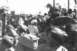 Spectators watching a fire walker, Calcutta, India, late 1944, photo 1 of 5