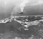 Olongapo jetty in Subic Bay, Philippines, 15 Dec 1944 with the troop ship, Oryoku Maru that was being used to transport 1,620 allied prisoners of war. The ship was attacked and sunk, killing 200 POWs. Photo 2 of 2.