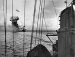 Cruiser USS St. Louis in Leyte Gulf, Philippines immediately after being struck by an Aichi D3A “Val” dive bomber, 27 Nov 1944.