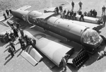 Civilian workers pose with sections of an Airspeed Horsa glider, as received from the manufacturers, before assembly at No. 6 Maintenance Unit, Brize Norton, Oxfordshire, England, United Kingdom, 26 Apr 1944.