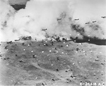 United States Army paratroopers dropped from C-47 Skytrains parachuting into Nazdab, New Guinea behind a smoke screen, 5 Sep 1943.