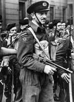 French Commandos celebrate Bastille Day on the parade grounds of Wellington Barracks, London, United Kingdom, 14 Jul 1943. Note the Thompson sub-machine gun.