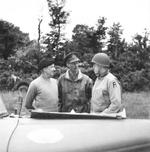 Generals Bernard Montgomery, Miles Dempsey, and Omar Bradley at a meeting in the field in Port-en-Bessin, France during the Normandy campaign, 10 Jun 1944.