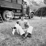 General Bernard Montgomery relaxing with his traveling companions, a fox terrier puppy named “Hitler” and a spaniel puppy named “Rommel,” at his headquarters at Blay, Normandy, France, 6 Jul 1944.