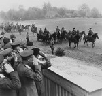 British Field Marshal Bernard Montgomery salutes Russian cavalry passing in review during a visit to the headquarters of Soviet General Konstantin Rokossovsky in Wismar, Germany, 7 May 1945.