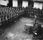 Field Marshal Bernard Montgomery using a Jeep as a platform to address the 7th Armoured Division (the “Desert Rats) at their headquarters at Bree, Belgium near the Dutch border, 30 Nov 1944.