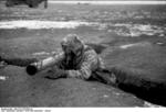 German soldier with Panzerschreck launcher and gas mask, southern Ukraine, circa Dec 1943-Jan 1944, photo 1 of 2