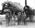 Medical officer of the 535th Bomb Squadron, Capt Graham, congratulating pilot Lt Biene of B-17G Fortress ‘Stage Door Canteen,’ on the bomber’s 100th mission, 25 Feb 1945 at Ridgewell, Essex, England, United Kingdom.