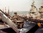 Battleship USS Iowa and carrier USS Shangri-La receiving fuel from oiler USS Cahaba, 8 Jul 1945. Photo 1 of 5.