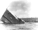 The bow section of the sunken destroyer USS Tucker sticking out of the water off Malo Island, Espiritu Santo, New Hebrides, circa Sep 1942.