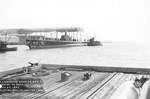 Tug boats towing the submarine Growler to the fitting out piers after being launched at the Electric Boat Company, Groton, Connecticut, United States, 22 Nov 1941.