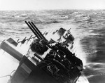 Cruiser USS Santa Fe rolling heavily during Typhoon Cobra in the Philippine Sea, 18 Dec 1944. Note the forward turret trained to the side so water over the bow would not enter through the gun ports.