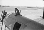 WAAF personnel working on a Horsa aircraft of the Heavy Glider Conversion Unit at Brize Norton, Carterton, Oxfordshire, England, United Kingdom, 1940s; note Whitley glider tugs in background