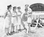 RAF firefighter demonstrating the handling of a hose to WAAF recruits, Egypt, 1940-1943