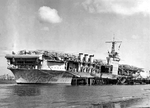 USS Ranger at North Island, San Diego, California, United States, 14 Mar 1938. Note the bends in the stacks that allow them to swing outboard for flight operations.