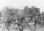 USS S-36, USS S-39, USS S-37, and USS S-41 moored alongside of USS Canopus, Qingdao, Shandong Province, China, circa 1930; note Chinese civilians mingling with US sailors