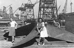 Publicity photo of the propeller for the first ship built at the CalShip yards, John C Fremont, Los Angeles, California, United States, fall 1941. The women in front are Bettie Ober and Isabel Bork.