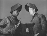 CalShip journeyman welder Jesse Kermit Lucas and his apprentice, Rodney Gail Chesney, while they were working on Liberty-ship Booker T Washington, Los Angeles, California, United States, Sep 1942.