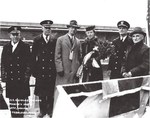 Dignitaries posing for pictures at the christening of the Fletcher-class destroyer Nicholas at the Bath Iron Works, Bath, Maine, United States, 19 Feb 1942.